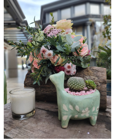 Doce harmonia| buquê de flores com um jardim e vela